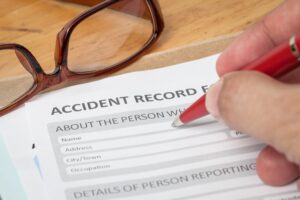 An employee fills out an accident record form after an accident at work